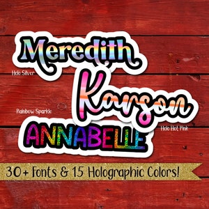 May include: Three personalized name stickers with holographic finishes. The names are Meredith, Karson, and Annabelle. The stickers have a white background and black outlines. The text "30+ Fonts & 15 Holographic Colors!" is at the bottom of the image.