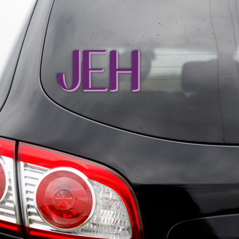May include: A black car with a purple vinyl sticker that says "JEH" on the back window.