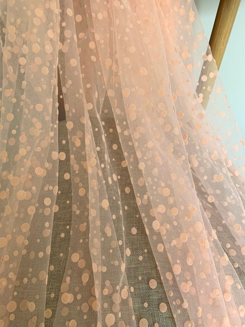 Peach pink polka dotted tulle fabric image 1