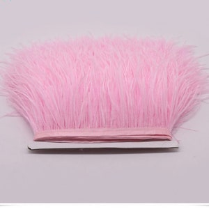May include: Pink feather trim, a soft and fluffy trim for crafts and embellishments.