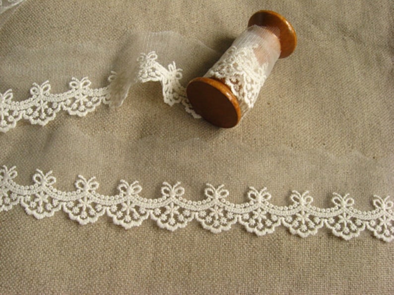 ivory lace trim , small cotton embroidered lace, scalloped lace with bows image 1