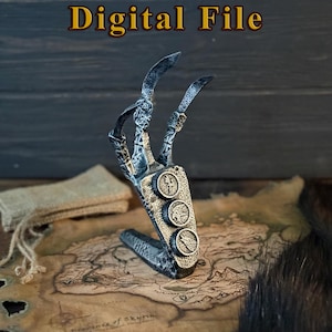 Könnte beinhalten: Ein silberfarbener, klauenförmiger Ständer mit komplizierten keltischen Knotenmustern und drei kreisförmigen Medaillons mit geprägten Tiermotiven. Der Text Digital File steht in einer fetten Serifenschrift über dem Objekt.
