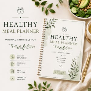 Può includere: Un pianificatore di pasti sani con rilegatura a spirale, copertina bianca con illustrazioni di foglie verdi, il testo "HEALTHY MEAL PLANNER", "PLAN • NOURISH • THRIVE" e "A HEALTHIER YOU STARTS HERE". Include icone e testo informativo.
