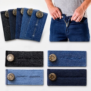 May include: A set of rectangular denim waist extenders in various shades of blue and black, each featuring a metallic button with a star and leaf design. These fabric strips include buttonholes to adjust the fit of trousers and jeans.