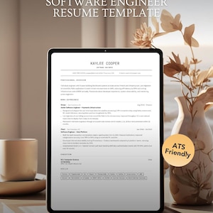 May include: A digital tablet displaying a Software Engineer Resume Template for Kaylee Cooper. The screen shows professional experience, education, and skills sections. A circular orange badge on the right side contains the text ATS Friendly.