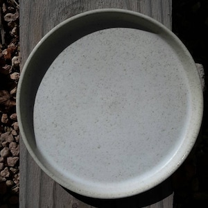 Wheel formed stoneware plate. 28cm.