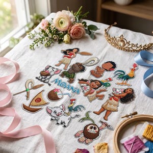 May include: A collection of embroidered patches featuring characters and icons from the movie Moana, including Moana, Maui, Pua the pig, Heihei the rooster, a boat, a coconut, and the text Moana, arranged on a white fabric surface with flowers.