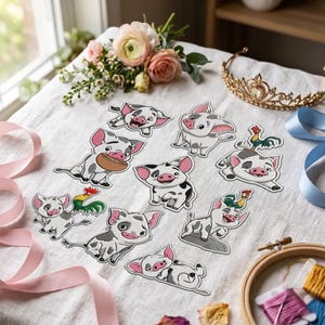 May include: A collection of nine die-cut stickers featuring a cartoon piglet in various poses, some accompanied by a small rooster. The stickers are arranged on a white fabric surface alongside a bouquet of pink roses, a gold tiara, and pink ribbons.