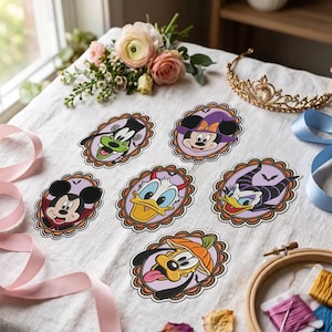 May include: Six oval stickers featuring Disney characters in Halloween costumes, including Mickey Mouse as a vampire, Minnie Mouse as a witch, Donald Duck as a devil, Goofy as a monster, Daisy Duck as Maleficent, and Pluto wearing a pumpkin hat.
