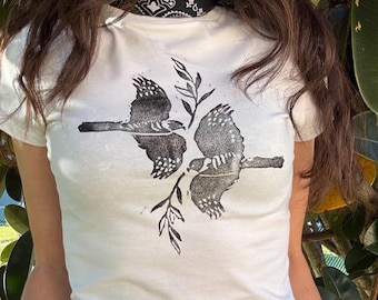 White Baby Tee – Two Hawks with Branches – Hand Carved Linocut Print
