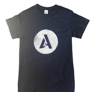 May include: A dark blue t-shirt with a white circle graphic featuring a stylized letter "A" and the text "always and forever".