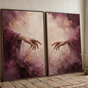 May include: A diptych wall art set featuring two rectangular canvases with a textured impasto oil painting. The artwork depicts two hands reaching toward each other in shades of deep plum, mauve, and cream, connected by a thin, delicate gold line.