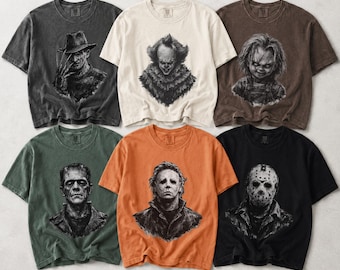 Op de afbeelding: Zes t-shirts met korte mouwen in antraciet, crème, bruin, olijfgroen, oranje en zwart. Elk shirt heeft een gedetailleerde zwart-witte grafische print van een horrorfilmpersonage, waaronder Freddy Krueger, Pennywise, Chucky, Frankenstein, Michael Myers en Jason Voorhees. De tekst Comfort Colors staat in het rood in de rechterbenedenhoek.
