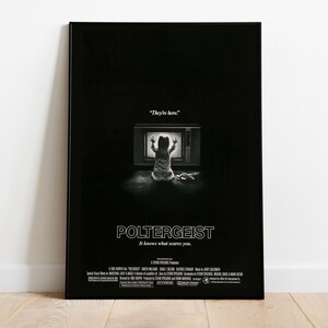May include: A black and white movie poster for Poltergeist featuring a child sitting before a glowing television screen with hands pressed against the glass. The text reads They're here, Poltergeist, and It knows what scares you, with credits.