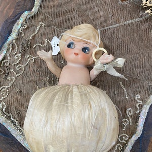 Antique doll  hand painted with beautiful silk skirt pincushion