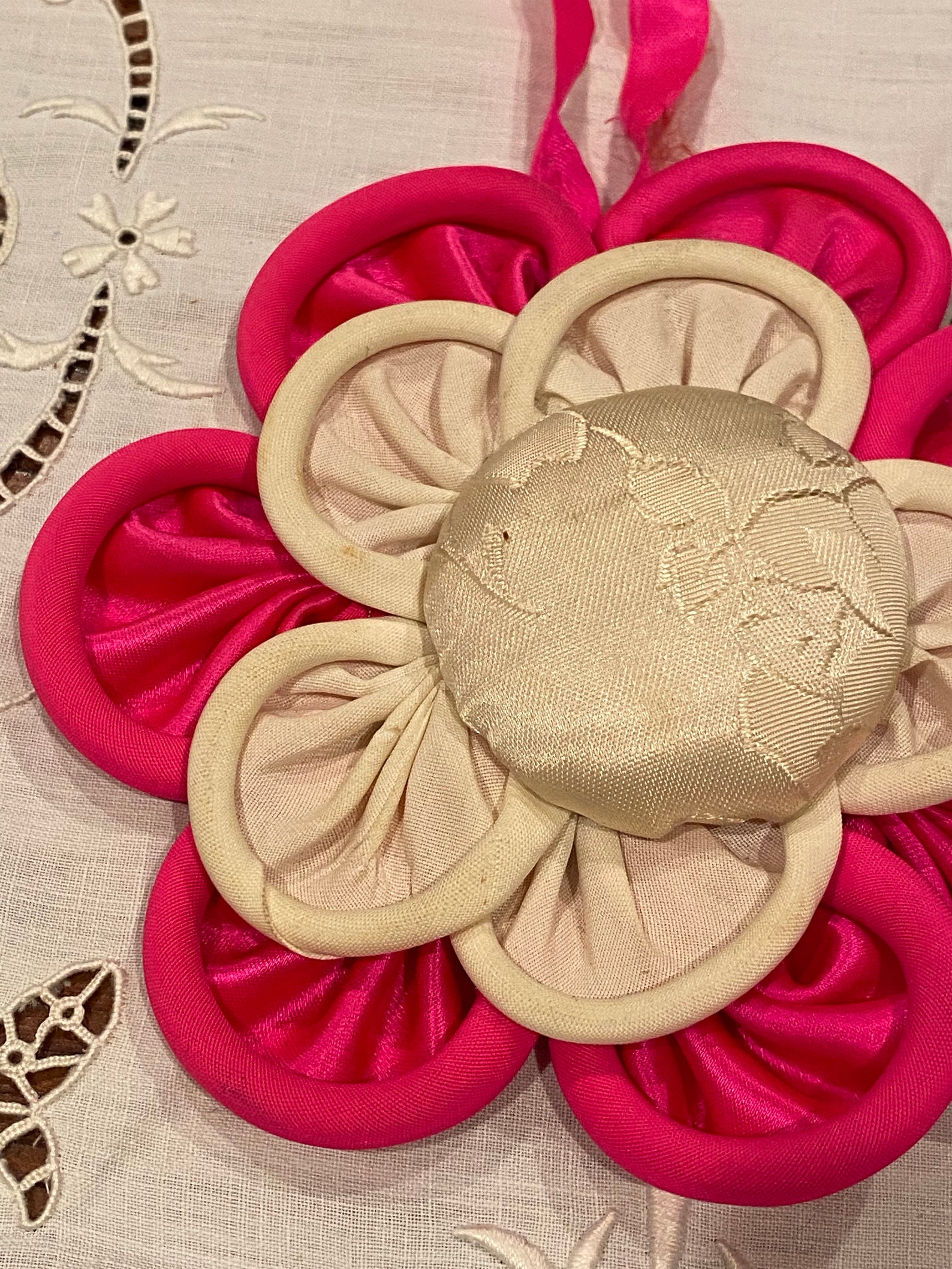 Rosette appliqués silk top in ivory