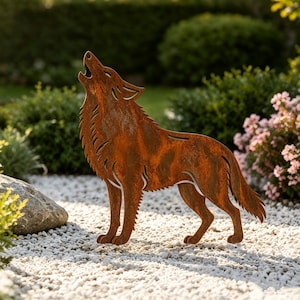 May include: A flat, metal garden sculpture of a wolf in a howling pose with its head tilted upwards. The figure features a textured, rusted brown finish and cut-out details that define the fur, ears, and facial features of the animal.