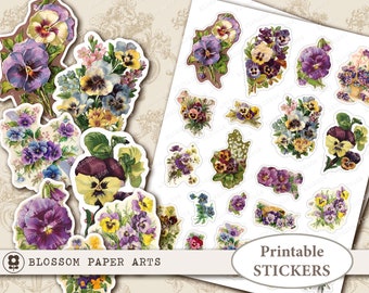 Puede incluir: Pegatinas imprimibles con ilustraciones vintage de pensamientos morados y blancos con hojas verdes. Las pegatinas están dispuestas en una cuadrícula sobre un fondo blanco. El texto "Pegatinas imprimibles" está en la parte inferior de la imagen.
