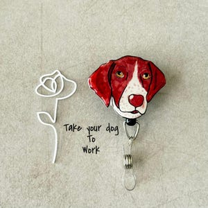 May include: A red and white dog head badge reel with the text "Take your dog to work" written below.