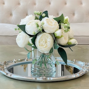 winter white artificial flowers arrangement in glass vase. Faux hydrangeas,  white peony and skimmia — Victoria James Floral Designs