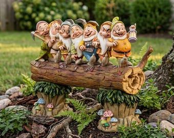 May include: A decorative garden figurine featuring seven dwarf characters standing in a row on a textured brown log. The log is supported by two tree stump bases adorned with small, colorful sculpted mushrooms in shades of red, blue, and white.