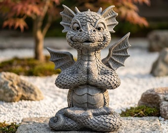 May include: A gray stone-colored dragon statue in a seated meditation pose with hands pressed together in front of the chest. The dragon features textured scales, pointed ears, and small wings, with a smiling expression on its face.