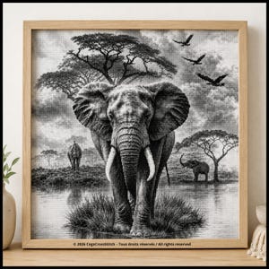 Op de afbeelding: Een zwart-wit kruissteekpatroon in een lichthouten lijst met een grote olifant die in het water staat, met kleinere olifanten en vogels op de achtergrond onder bomen. De tekst onderaan luidt 2026 CegaCrossStitch - Tous droits réservés / All rights reserved.
