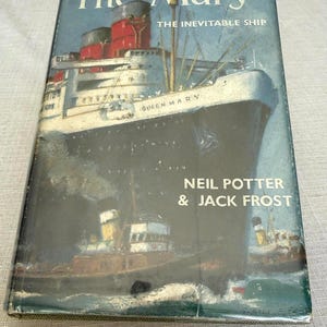 May include: A hardcover book titled The Mary: The Inevitable Ship by Neil Potter and Jack Frost. The dust jacket features a dark blue and white illustration of the Queen Mary ocean liner with red smokestacks, sailing on water with a smaller tugboat.