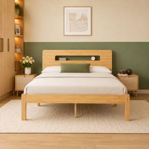 May include: A light-toned wooden bed frame featuring a headboard with a horizontal cutout shelf. The bed is dressed in white bedding and a single olive green rectangular bolster pillow. The frame is supported by four legs and a central support.