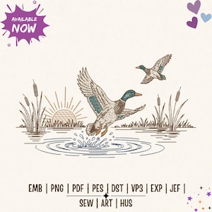 May include: An embroidery design featuring two mallard ducks in flight over a pond with cattails and a rising sun. The text AVAILABLE NOW appears in a purple burst at the top left, and file formats EMB, PNG, PDF, PES, DST, VP3, EXP, JEF, SEW, ART, HUS are listed at the bottom.