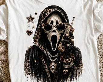 May include: A white t-shirt featuring a graphic of a hooded figure wearing leopard print accents, black cat-eye sunglasses, and a rhinestone-covered telephone. The design includes a matching leopard print star, heart, and a ghost-face pendant necklace.
