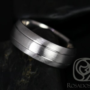 May include: A brushed silver wedding band with two thin grooves around the center of the band.