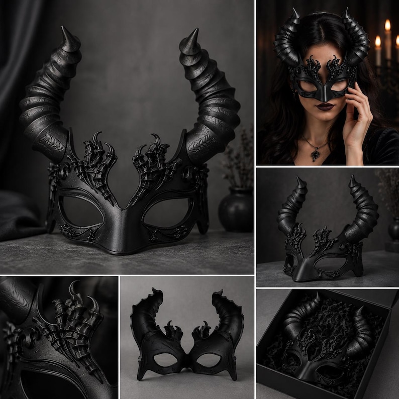 May include: A black masquerade mask featuring two large, textured, spiraled horns extending upward. The mask has intricate, raised filigree detailing around the eye openings and a smooth, contoured bridge. It is presented in a black gift box.