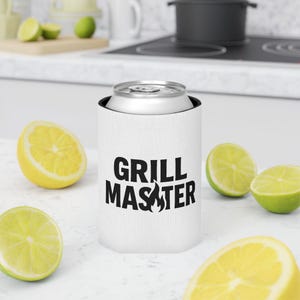 A white cooler with the text "GRILL MASTER" printed on it, surrounded by sliced lemons and limes on a kitchen counter.