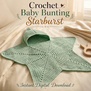 May include: A light green crochet baby bunting in a starburst shape with an attached hood. The text reads Crochet Baby Bunting Starburst and Instant Digital Download. A small wooden ring toy with two rounded ears sits to the right of the bunting.