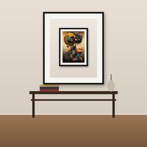 May include: A framed wall art print featuring a stylized figure surrounded by floating spheres in shades of gold, orange, and deep blue. The artwork is displayed in a black frame with a white mat, resting on a dark brown console table with books.