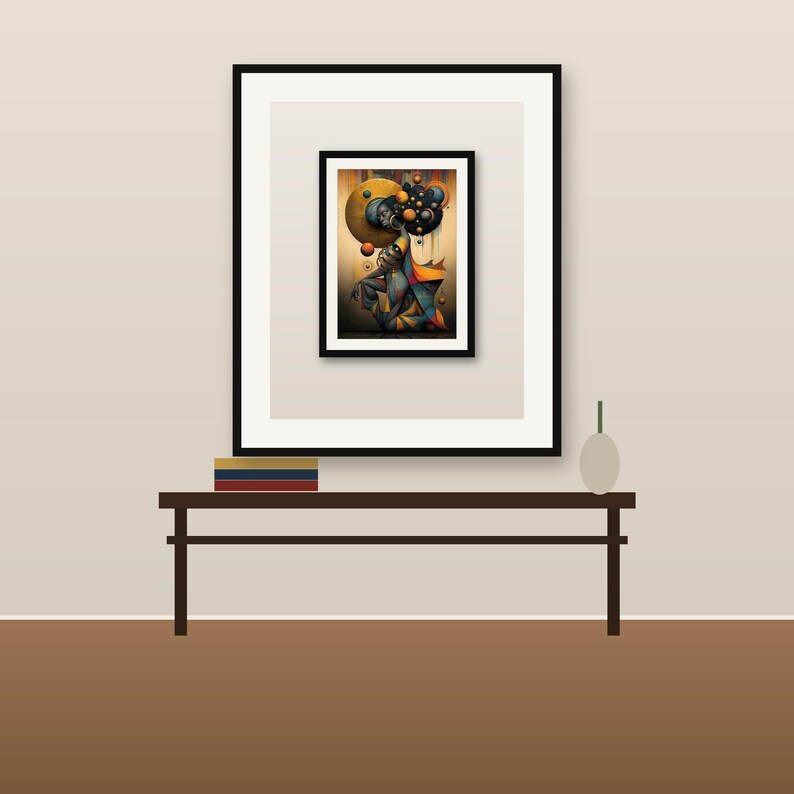 May include: A framed wall art print featuring a stylized figure surrounded by floating spheres in shades of gold, orange, and deep blue. The artwork is displayed in a black frame with a white mat, resting on a dark brown console table with books.