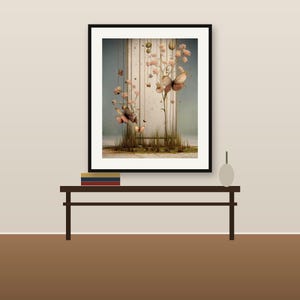 May include: A framed wall art print featuring a vertical rectangular panel with thin hanging lines, delicate pink floral branches, and several butterflies in shades of brown and orange, set against a soft, muted background.