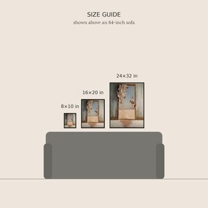 May include: A size guide graphic showing three framed rectangular wall art prints above an 84-inch sofa. The prints are labeled 8x10 in, 16x20 in, and 24x32 in. Each print features a doorway scene with butterflies and a desert landscape.