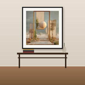 May include: A framed wall art print featuring a surreal desert landscape with tall rectangular panels, a large beige sphere, a cactus, and sparse trees under a cloudy sky, displayed in a black frame on a dark brown console table.