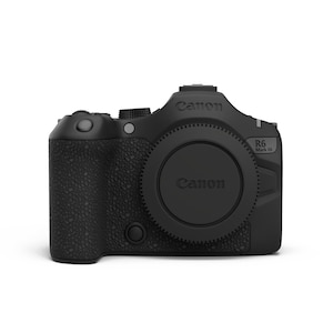 May include: A black Canon R6 Mark III mirrorless camera body with a textured grip, a central lens mount cap featuring the Canon logo, a top control dial, and a shutter button. The camera body displays the Canon brand name and the model name R6 Mark III.