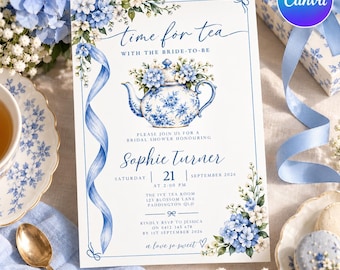 May include: A rectangular bridal shower invitation card featuring a blue and white floral teapot illustration, blue hydrangea accents, and a blue ribbon border. The text reads time for tea with the bride-to-be, Sophie Turner, Saturday 21 September 2026 at 2:00 PM, The Ivy Tea Room, 123 Blossom Lane, Paddington QLD, and RSVP details.