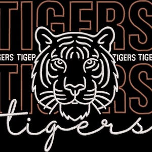 May include: A black embroidered design featuring a central white tiger head outline. The word TIGERS is repeated in large copper-colored block letters in the background, while the word tigers is written in white cursive script at the bottom.