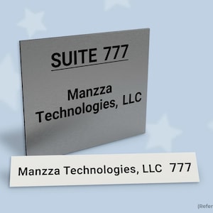May include: A square silver-toned office sign featuring the black text SUITE 777 and Manzza Technologies, LLC, accompanied by a rectangular white label displaying the black text Manzza Technologies, LLC 777 on a light blue background with stars.