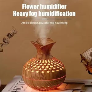 May include: A wood-grain finish humidifier with a flower-shaped top emitting a steady stream of mist. The spherical base features a cut-out pattern that glows with internal light. Text above reads: Flower humidifier, Heavy fog humidification.
