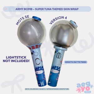 May include: Two light blue lightsticks featuring a Super Tuna themed skin wrap with a smooth matte finish. The design includes fish graphics, the text SUPER, and Korean characters. Labels indicate MOTS SE and VERSION 4. Lightstick not included.