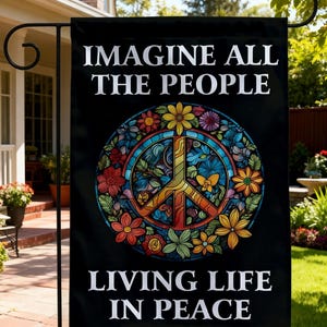 May include: A black rectangular garden flag featuring the white text IMAGINE ALL THE PEOPLE and LIVING LIFE IN PEACE. In the center is a circular stained glass style design of a peace sign surrounded by colorful flowers, leaves, and butterflies.