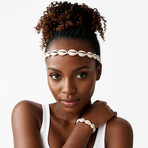 Afrikansk kaurisnäcka Heapice och matchande armband.