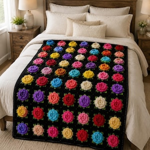May include: A rectangular crochet blanket featuring a black background with a repeating pattern of three-dimensional floral motifs in various colors including red, yellow, blue, pink, purple, and white, arranged in a grid across the entire surface.
