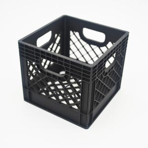 May include: A square, black plastic storage crate featuring a grid-like, open-weave pattern on all four sides. The crate includes integrated handles on each side, reinforced corners, and a hollow interior, providing a sturdy structure for storage.